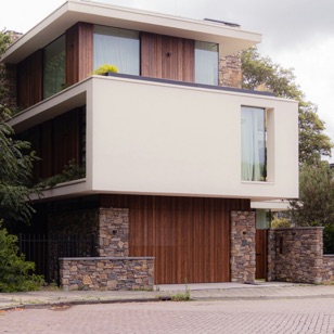 Contemporary two-storey home with timber and stone facade