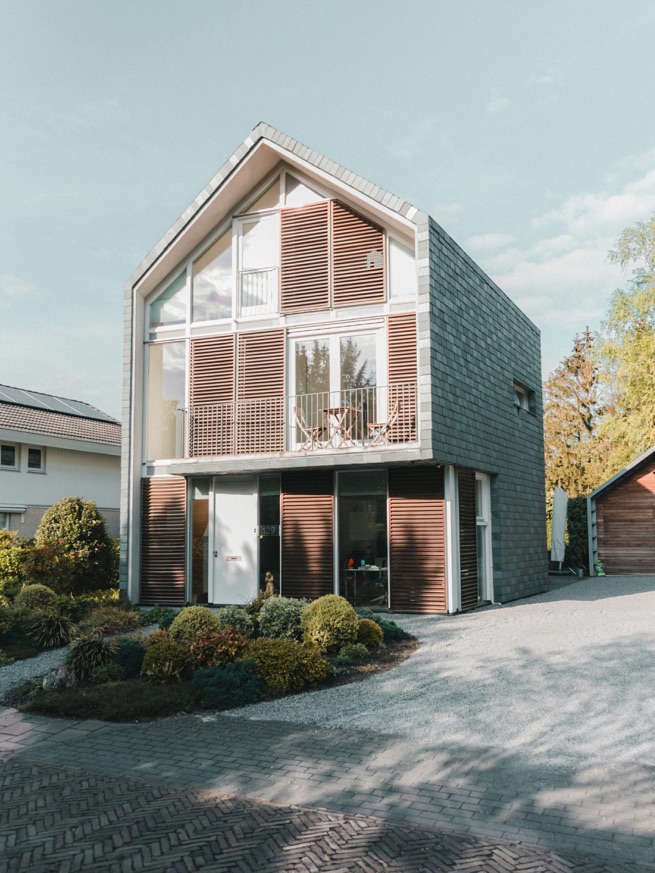 Contemporary gabled home with timber louvre screens